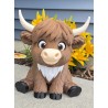 Sitting highland cow